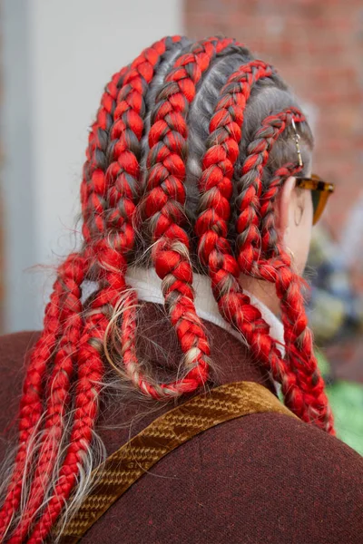 Woman with red braids and brown jacket before Fendi fashion show, Milan Fashion Week street style — Stock Photo, Image