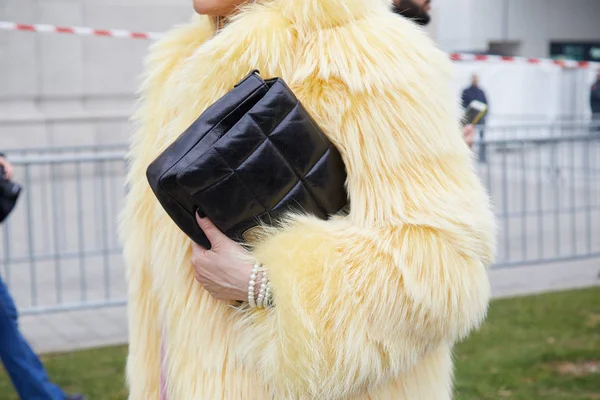 MILAN, ITALY - JANUARY 13, 2019: Woman with pink fur coat and brown Louis  Vuitton bag before John Richmond fashion show, Milan Fashion Week street  sty Stock Photo - Alamy