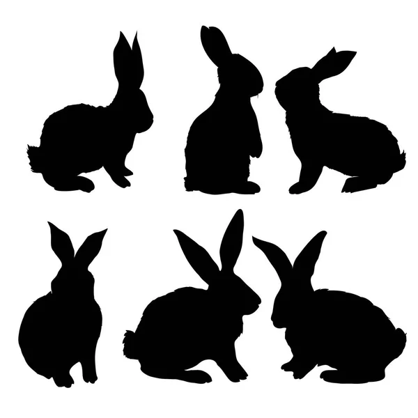 Conjunto de siluetas de conejo negro — Vector de stock