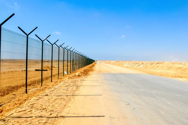Boundary fence of the Airport in the desert of Oman