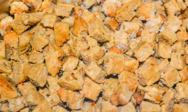 Frozen chopped chicken in metallic container