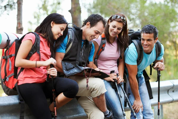 Hiking couples relaxing after trip — Stock Photo, Image