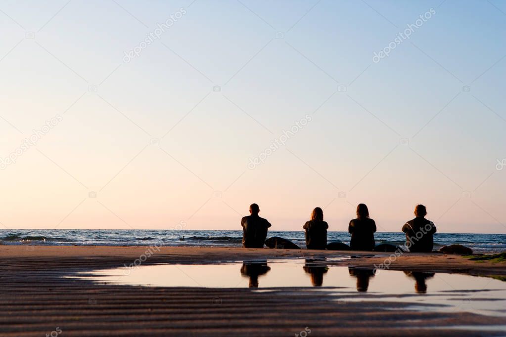 people sitting on beach