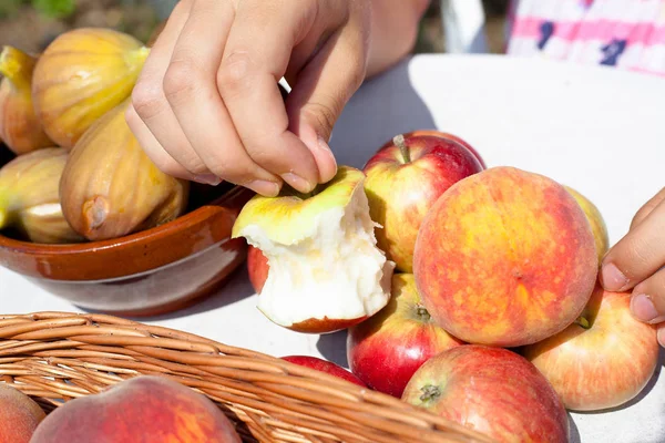 half-eaten apple on table