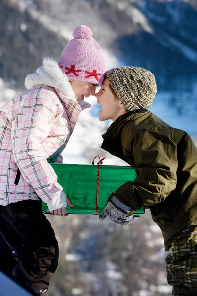 Children holding big present — Stock Photo, Image