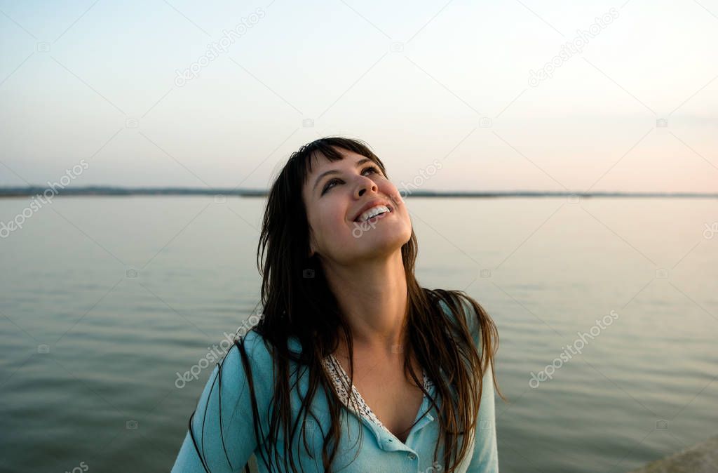 Girl laughing and looking skywards