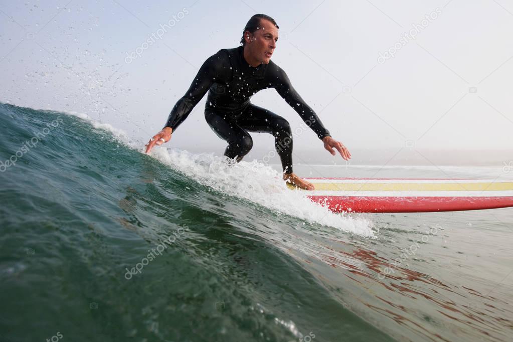 Man surfing ocean wave