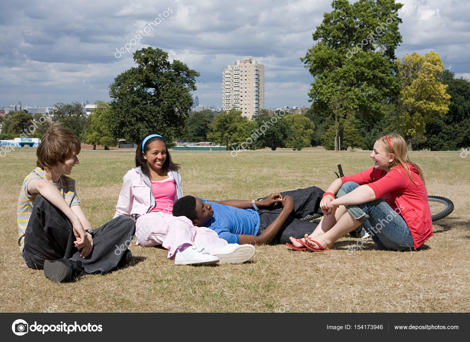 Teenagers in playing field Stock Photo by ©ImageSource 154173946