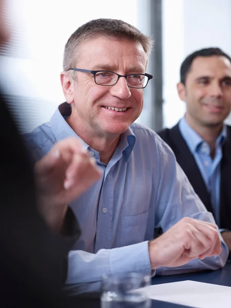 Individuals in group meeting