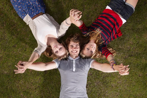 Three friends holding their hands up — Stock Photo, Image