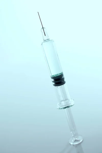 Medical syringe over light background — Stock Photo, Image