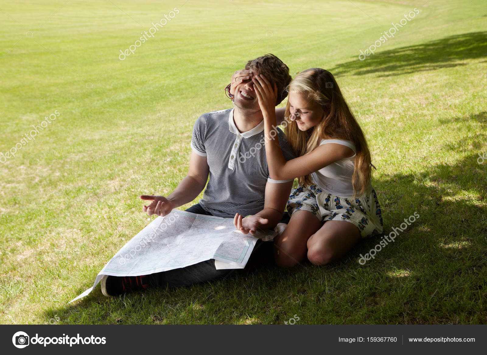 Girl Closing Boy Eyes With Hands Stock Photo C Imagesource
