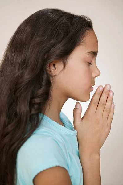 Portrait of praying girl Stock Photo