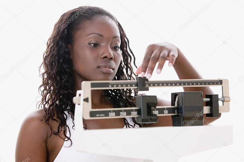 Woman weighing herself 