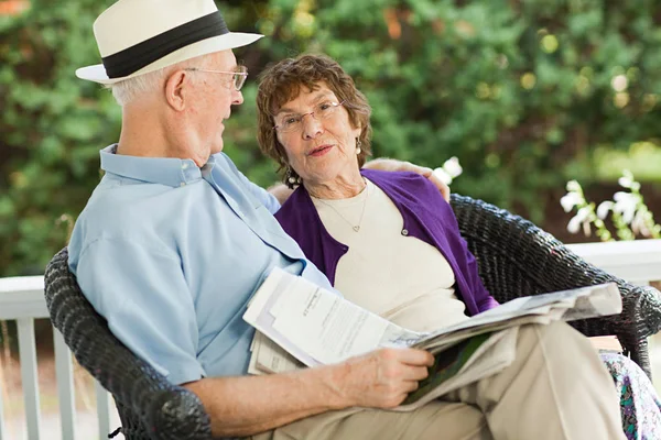 Senior couple with newspaper