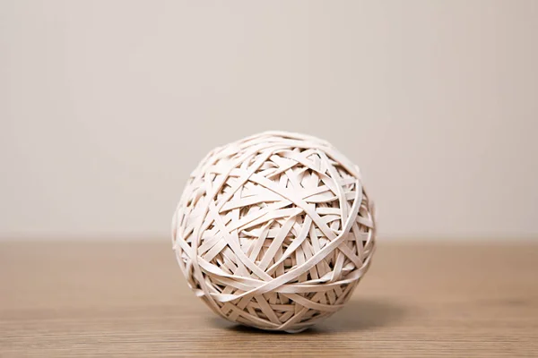 rubber band ball on wooden surface