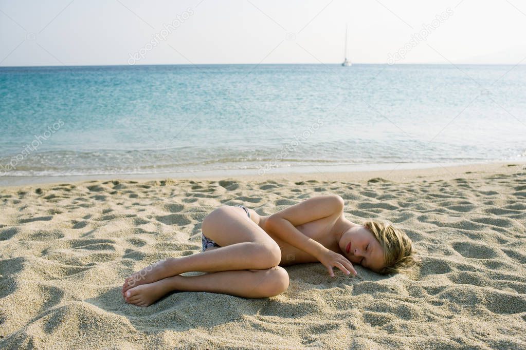 girl lying on beach