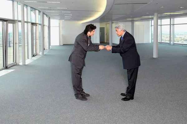 Businessmen exchanging business cards