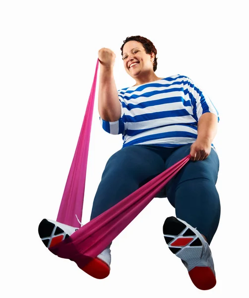 Large Woman Using Resistance Band — Stock Photo, Image