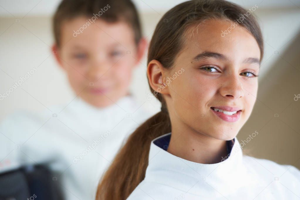 Girl wearing fencing costume