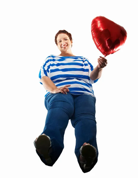 Large Woman Carrying Heart Balloon — Stock Photo, Image