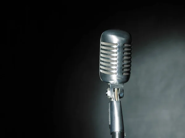 Retro microphone on dark — Stock Photo, Image