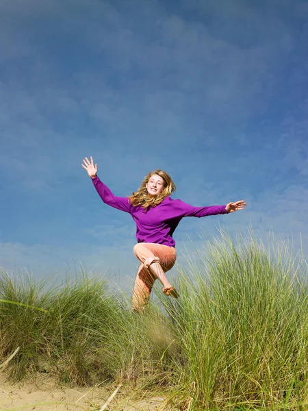 Teenage Girl Jumping Grass Stock Picture