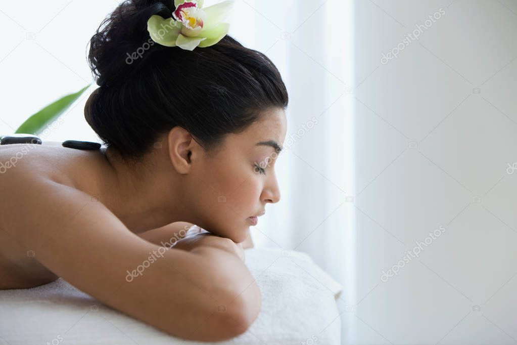 Young woman having stone therapy