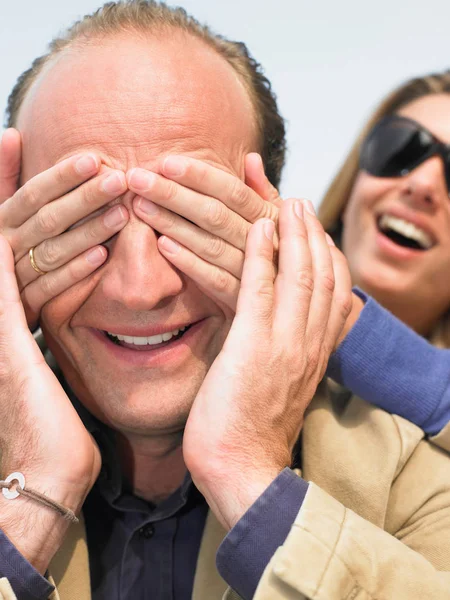 Woman Hiding Man Face Her Hands — Stock Photo, Image