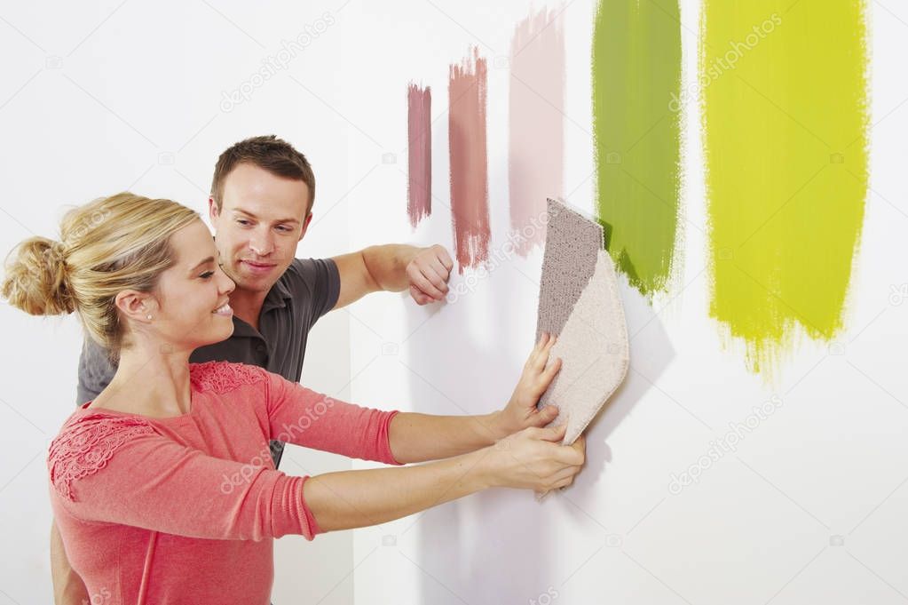 Couple looking at carpet samples.