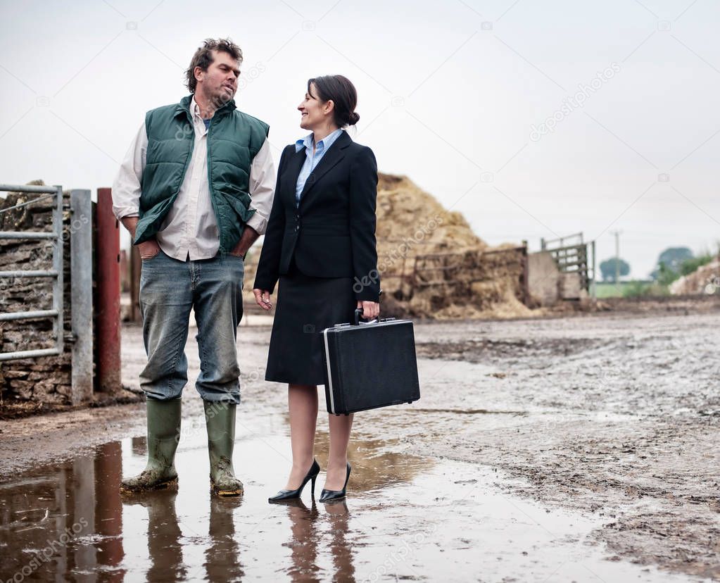 business woman talking with farmer