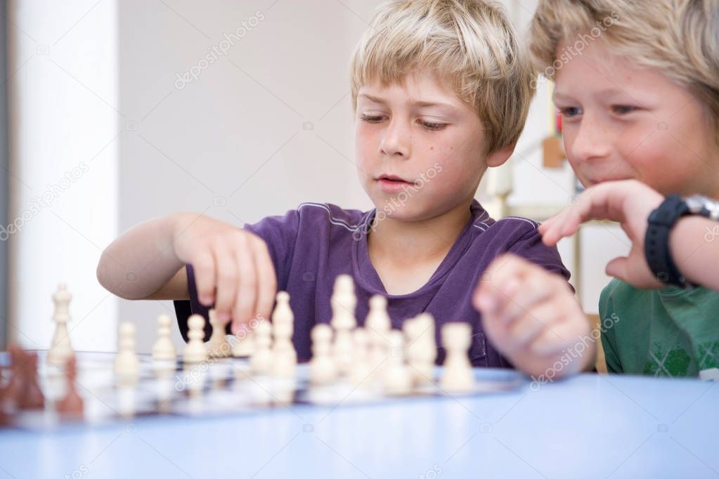 two Boys playing chess