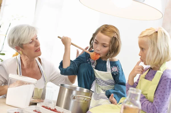 Girls Grandmother Cooking Jam — Stock Photo, Image