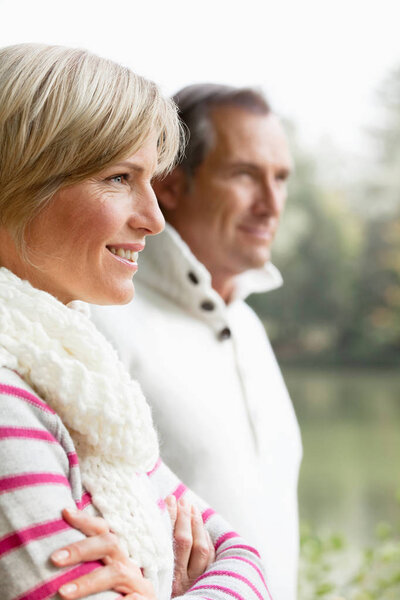 couple standing outdoors and looking away