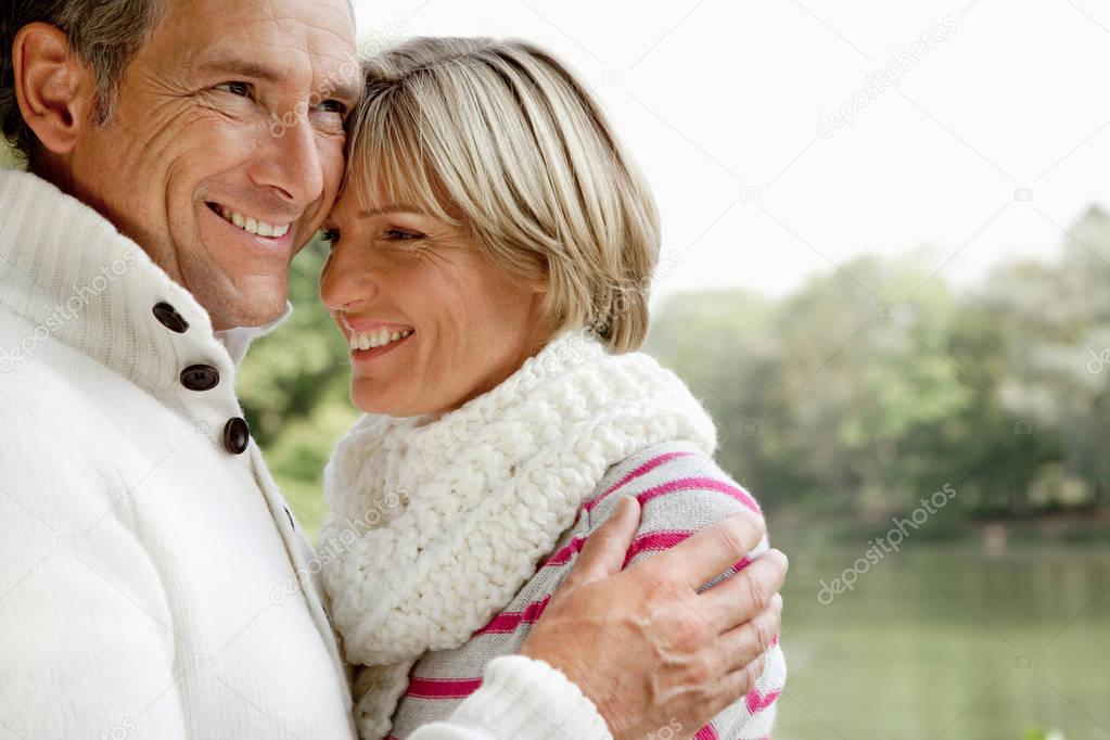 Middle aged couple hugging