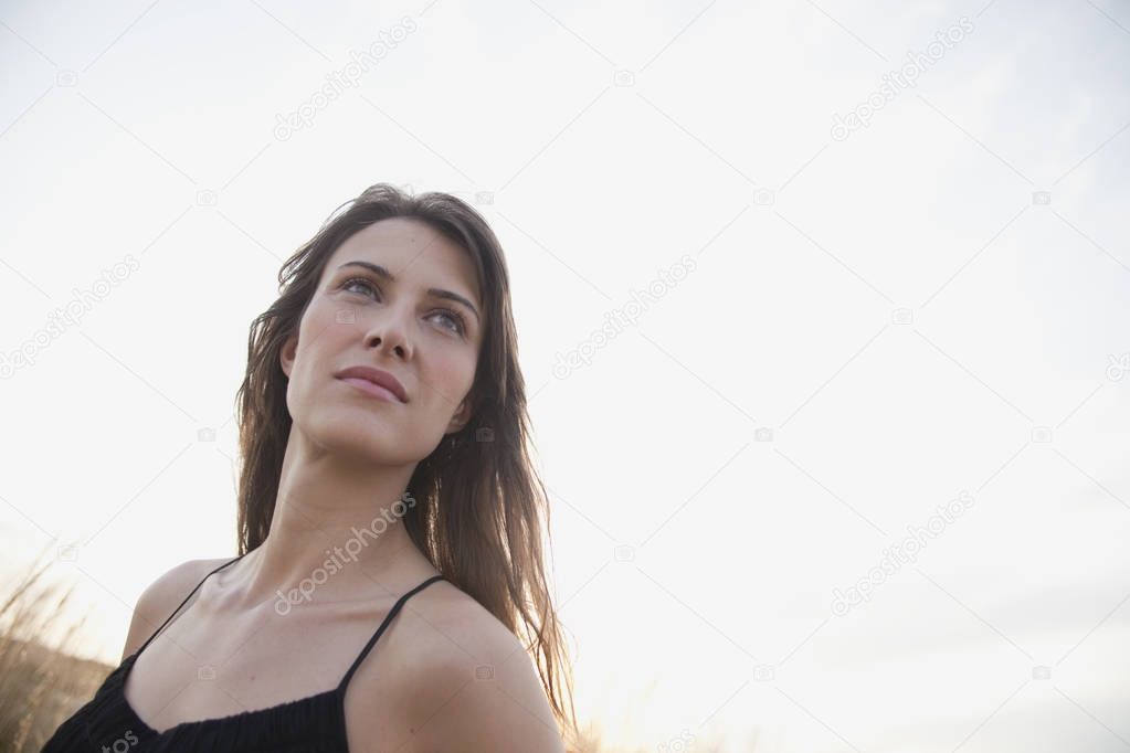 woman looking at view on beach