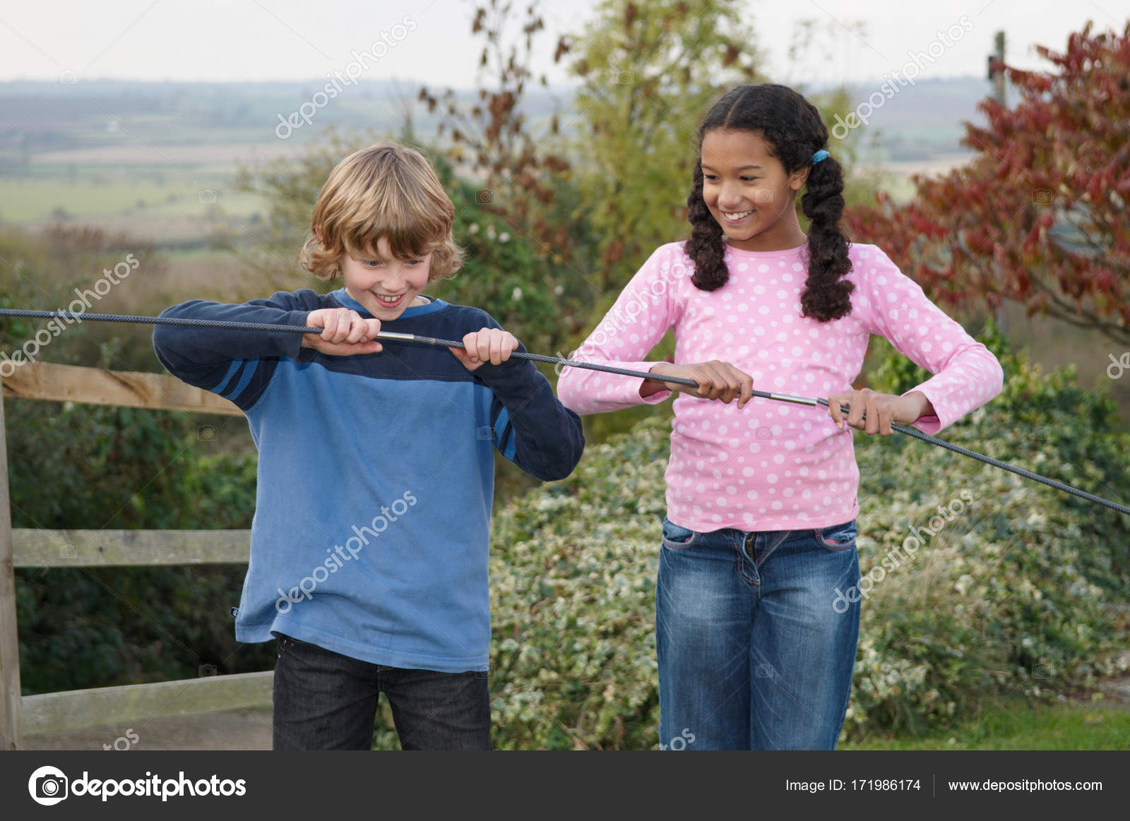 Boy Girl Tent Poles — Stock Photo © ImageSource 171986174