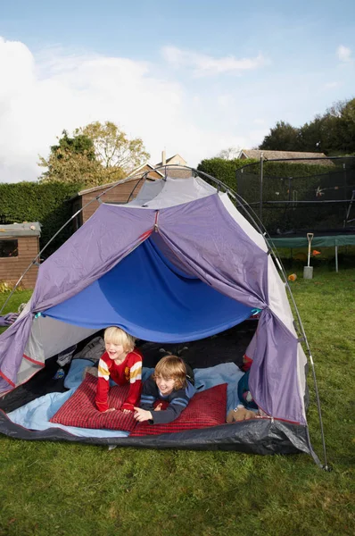 Two Boys Looking Out Tent — Φωτογραφία Αρχείου