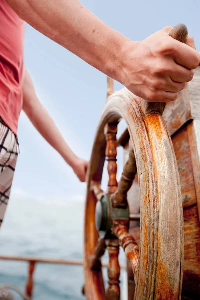 Man Standing Wooden Steering Wheel — Stock Photo, Image