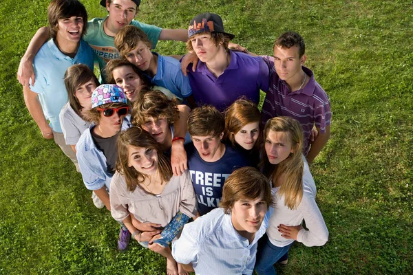 Teen group portrait standing looking up