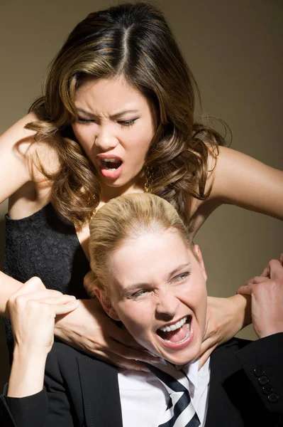 Two women fighting in studio