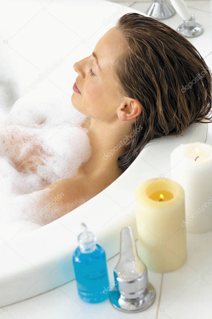 Woman relaxing in bath