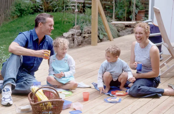 Family in garden playing and spending time together