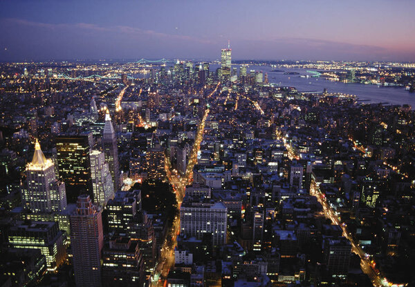 Aerial view of New York cityscape during night time, USA