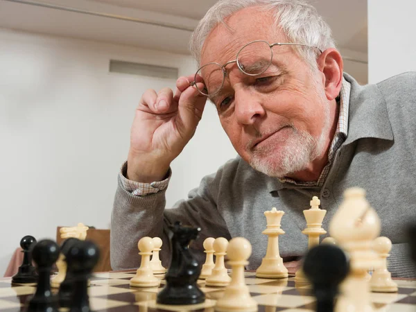 Senior man playing chess