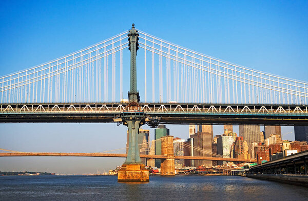 Manhattan bridge with skyscrapers on background, New York, USA