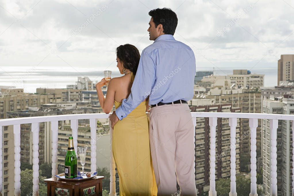 Rear view of a couple on a balcony