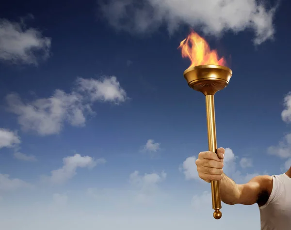 Athlete Holding Flaming Baton — Stock Photo, Image