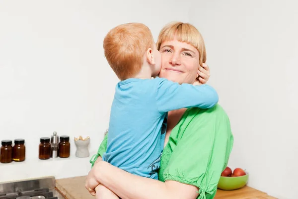 Caucasian Mother Son Hugging Kitchen — Stock Photo, Image