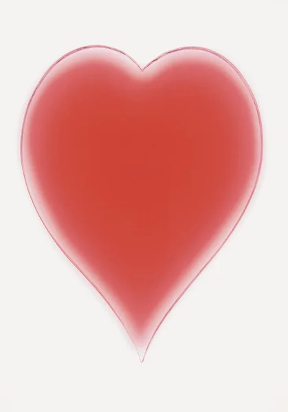红色心脏标志在灰色背景 — 图库照片